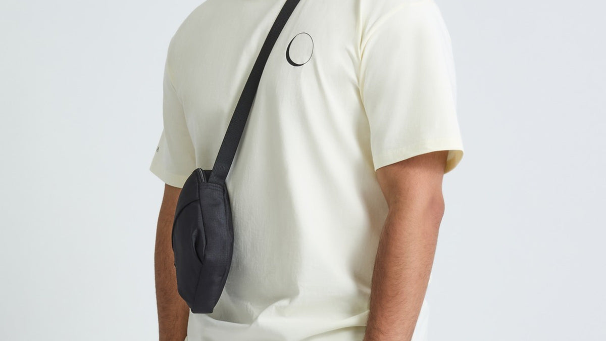 Cream ALUNA INNOVATION oversized t-shirt seen from the front, showing the dropped shoulder, wide short sleeve and the small crescent moon on the chest
