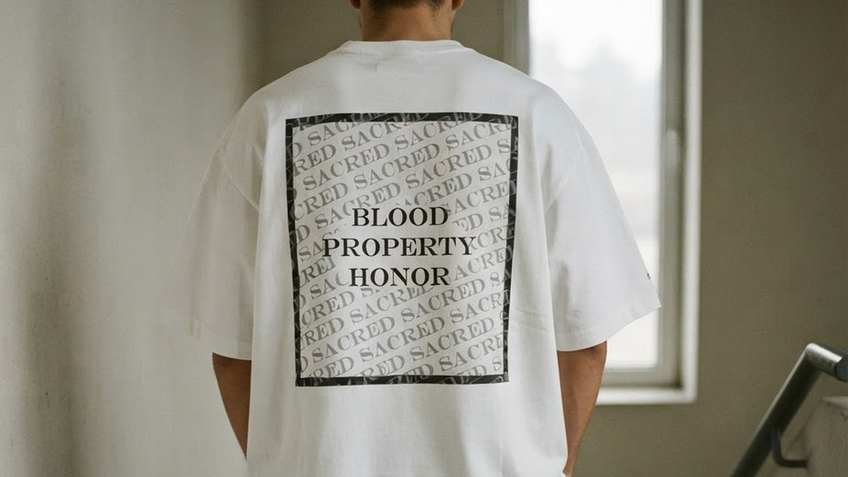 The back of the ALUNA SACRED oversized t-shirt in white, printed with Blood. Property. Honor.